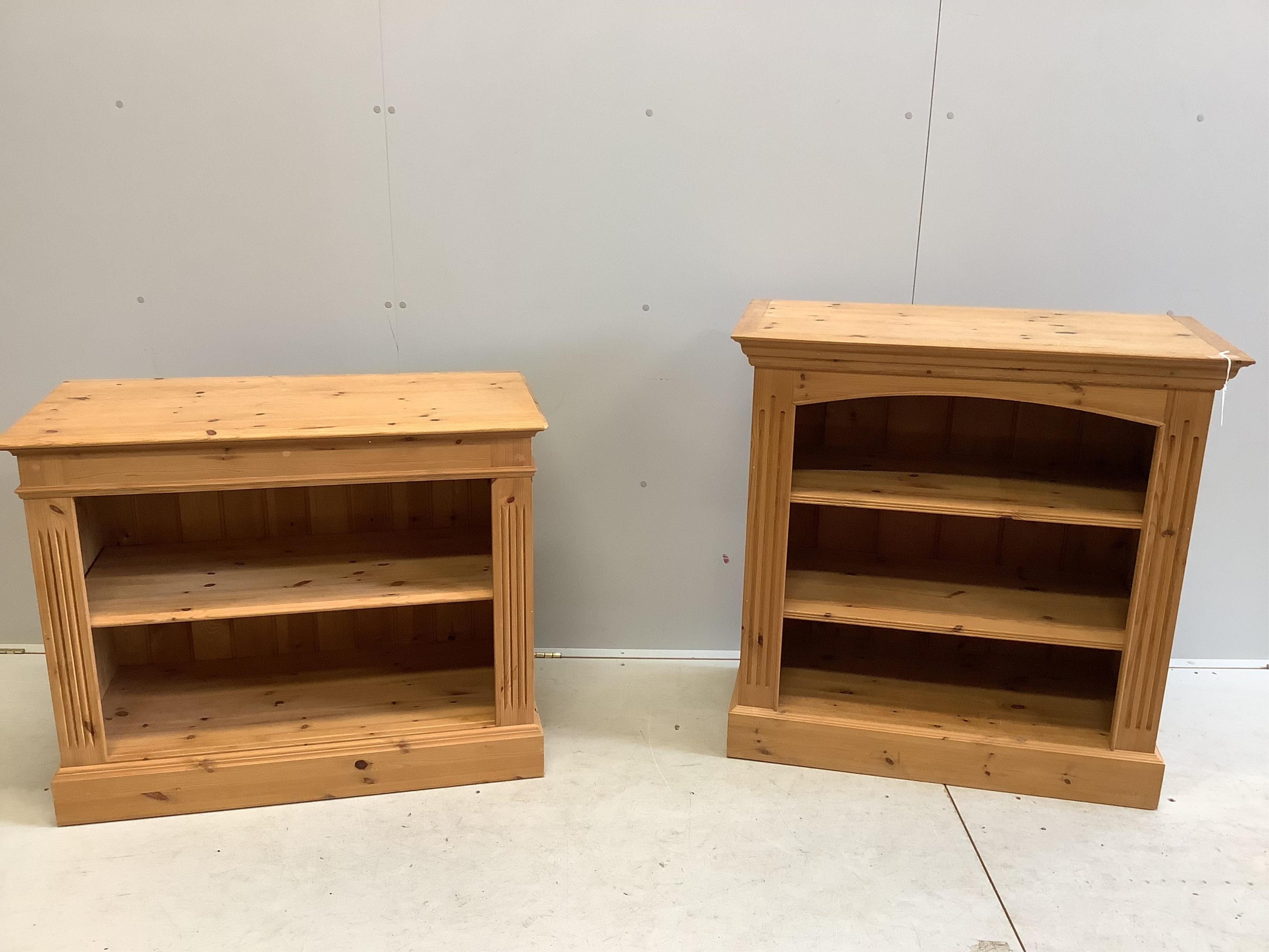 Two reproduction pine open bookcases, larger width 91cm, depth 44cm, height 92cm. Condition - fair